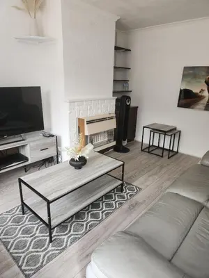 a living room with a couch and a coffee table at Beautiful two Bedroom house Entire house in Stevenage