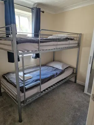 two bunk beds in a room with a window at SK Short Let