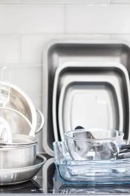 three bowls are sitting on top of a stove at Cozy One Bed Flat at Dawe Luxury Suites - An Entire Apartment near Ely Cathedral & Train Station - The Perfect Base to Explore Ely, Cambridge, Norfolk & London - 2 Guests Max & Pet Friendly in Ely