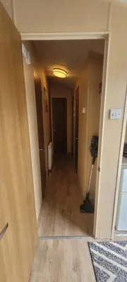 an empty hallway in a room with a hallway at Willerby Delux - Holiday Home by the Sea - close to the Entertainment Complex-bedding, towels & wifi Included! in Jaywick Sands