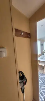 a room with a door with a helmet hanging on it at Willerby Delux - Holiday Home by the Sea - close to the Entertainment Complex-bedding, towels & wifi Included! in Jaywick Sands