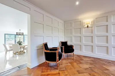 a dining room with white walls and a table and chairs at Mayrose House - 6BR 4BATH Luxe Spacious Retreat in Takeley