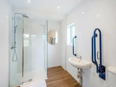 a bathroom with a shower and a sink at Mals Barn in Althorne