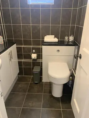 a small bathroom with a toilet and a sink at The Annexe Westbury House in Great Dunmow