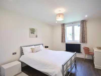 a bedroom with a white bed and a window at Whiskey Barns in Birch