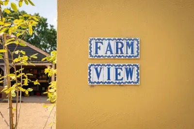 a sign on a wall that reads farm view at Farm View Cabin, Kelsale in Kelsale