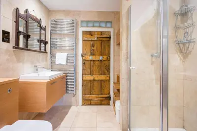 a bathroom with a sink and a shower at Farm View, ground floor bedroom in Kelsale