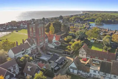 an aerial view of a town with a large building at Finest Retreats - ARC Thorpeness in Thorpeness
