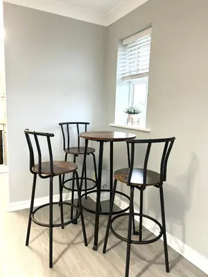 a group of chairs around a table in a room at Apartment I Sleeps 4 I Wi-Fi I Parking I Rail Links I Newmarket in Newmarket