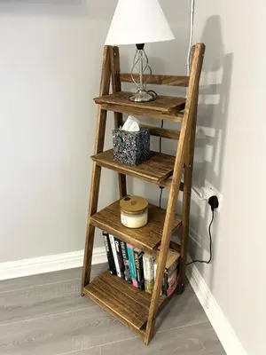a wooden book shelf with a lamp on top at Apartment I Sleeps 4 I Wi-Fi I Parking I Rail Links I Newmarket in Newmarket