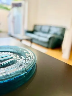 a blue plate sitting on top of a table at Beautiful Modern 2 Bed house combined with a vintage feel near Central Cambridge Sleeps 4 in Cambridge