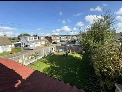 a view of a yard from a roof at The Larks Spacious 3BR Essex in Vange