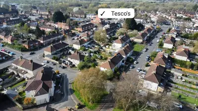 a small town with houses and a street at Spacious Riverside View Bungalow in Chelmsford