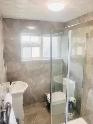 a bathroom with a shower and a sink at Rivenhall Garden Hotel in Rivenhall