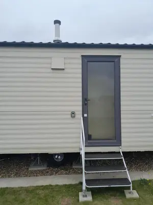 a ladder leading to the door of a trailer at Comfortable and Spacious Mobile home - Sleeps 6, in Clacton-on-Sea