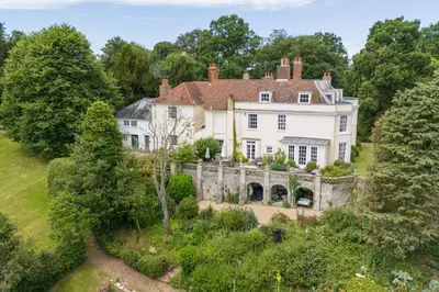 an aerial view of a large white house at Holbecks House by Group Retreats in Hadleigh