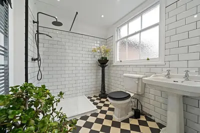 a bathroom with a toilet and a sink at Beautiful Home at the Heart of Colchester Great for Commuters or Professionals in Colchester
