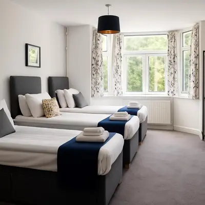 three beds in a room with windows at Free Parking-Modern Rooms in Central Cambridge Guest House by Luxiety Stays Near University in Cambridge