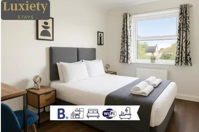 a hotel room with a bed and a window at Free Parking-Modern Rooms in Central Cambridge Guest House by Luxiety Stays Near University in Cambridge