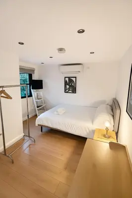 a bedroom with a bed and a desk in it at Cambridge City Centre by Luxiety Stays Stylish Rooms, Prime Location & Wi-Fi in Cambridge