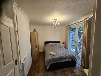 a small bedroom with a bed and a window at Meredith House, Ipswich in Ipswich