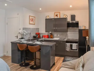 a kitchen with a large island in the middle at Saddlers - Uk50519 in Ovington