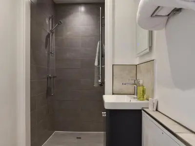 a small bathroom with a shower and a sink at Saddlers - Uk50519 in Ovington