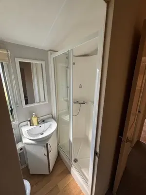 a bathroom with a shower and a sink at Singh&Leite Family L6 in Saint Osyth