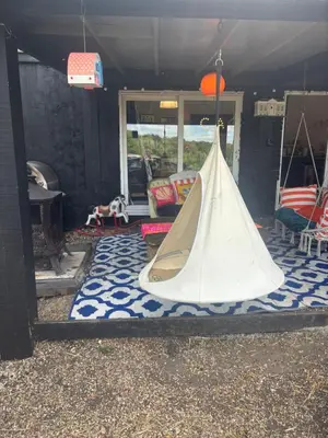 a tent sitting on a rug in a house at Goldings detached Barn farm stay in Hertford