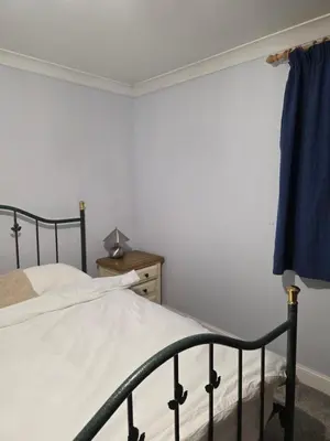 a bedroom with a bed and a dresser at Essex studio x2 in Hythe