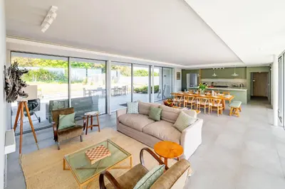 a living room with a couch and a table at Heath House 6 in Thorpeness