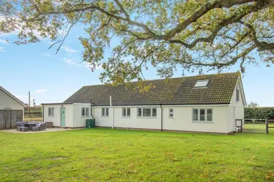 a white house with a large yard at 5 Bed in Washbrook oc-m33105 in Hintlesham