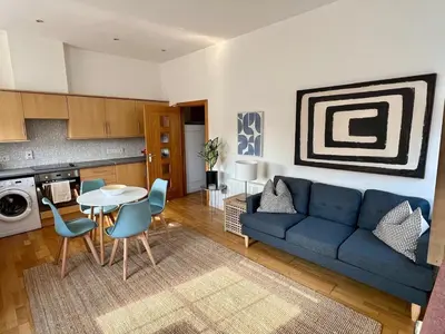 a living room with a blue couch and a table at Fabulous 2 bed in Leiston in Leiston