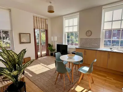 a living room with a table and chairs at Fabulous 2 bed in Leiston in Leiston