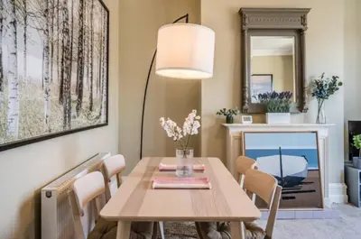 a dining room with a wooden table and chairs at Fabulous 1 bed in Aldeburgh in Aldeburgh