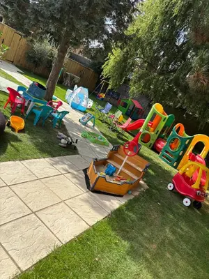 a group of colorful play equipment in a yard at Stylish Garden pod lodges in Milton
