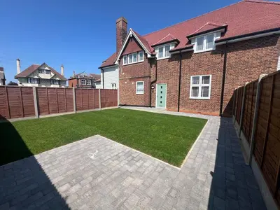 a brick house with a lawn in front of it at 4 The Royal Serviced Apartments, Harwich - Garden- Parking-Fast WiFi in Parkeston