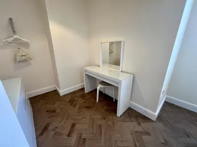 a white dressing table with a mirror in a room at 4 The Royal Serviced Apartments, Harwich - Garden- Parking-Fast WiFi in Parkeston