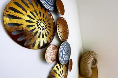 a group of plates hanging on a wall at Countryside Retreat - Indoor Pool, Sauna, Hot Tub in Fowlmere