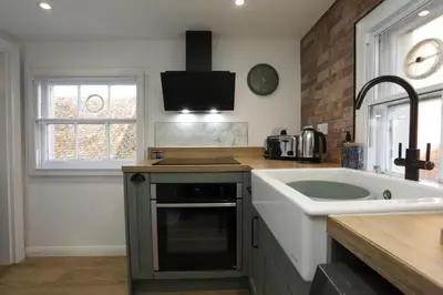 a kitchen with a sink and a counter top at Modern 2Bedroom Apartment Free Private Parking Woodbridge Central in Woodbridge