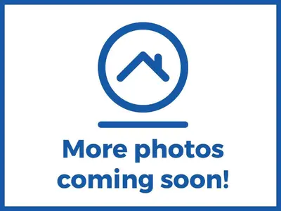 a sign that says more photos coming soon at Molly Cow Shed 6 in Woodbridge