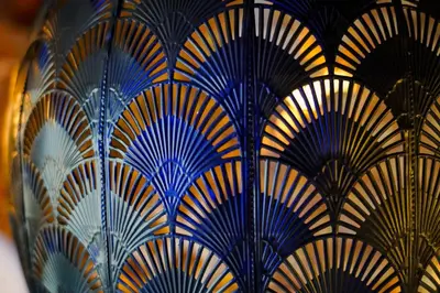 a bunch of blue and yellow fans on a wall at Bright & Spacious 5-Bedroom Stay near Cambridge in Hardwick