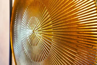 a close up of a gold leaf on a fan at Bright & Spacious 5-Bedroom Stay near Cambridge in Hardwick