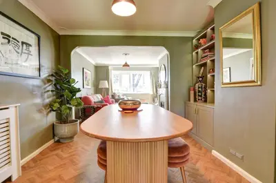 a kitchen with a wooden table in a room at Charming 4 bedroom home in Felsted in Felsted
