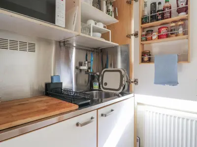 a kitchen with a sink and a counter top at Over Village Studio in Cambridge