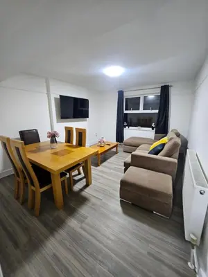 a living room with a table and a couch at Coral Bay Seaside Aparto in Clacton-on-Sea