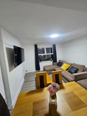 a living room with a couch and a table at Coral Bay Seaside Aparto in Clacton-on-Sea