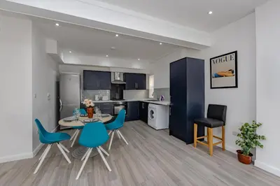 a kitchen and dining room with a table and chairs at Triple B Aparto in Clacton-on-Sea