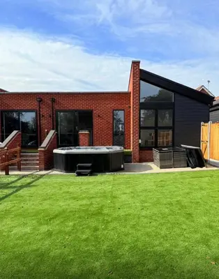 a house with a large lawn in front of it at Rural Retreats 9 and 10 in Southminster