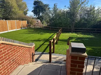 a yard with a fence and a grass field at Rural Retreats 9 and 10 in Southminster